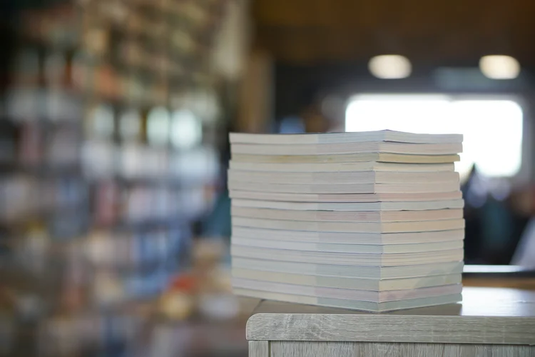 Stack of academic papers and publications