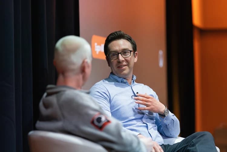 Paul Ferguson contributing to a panel discussion at a conference